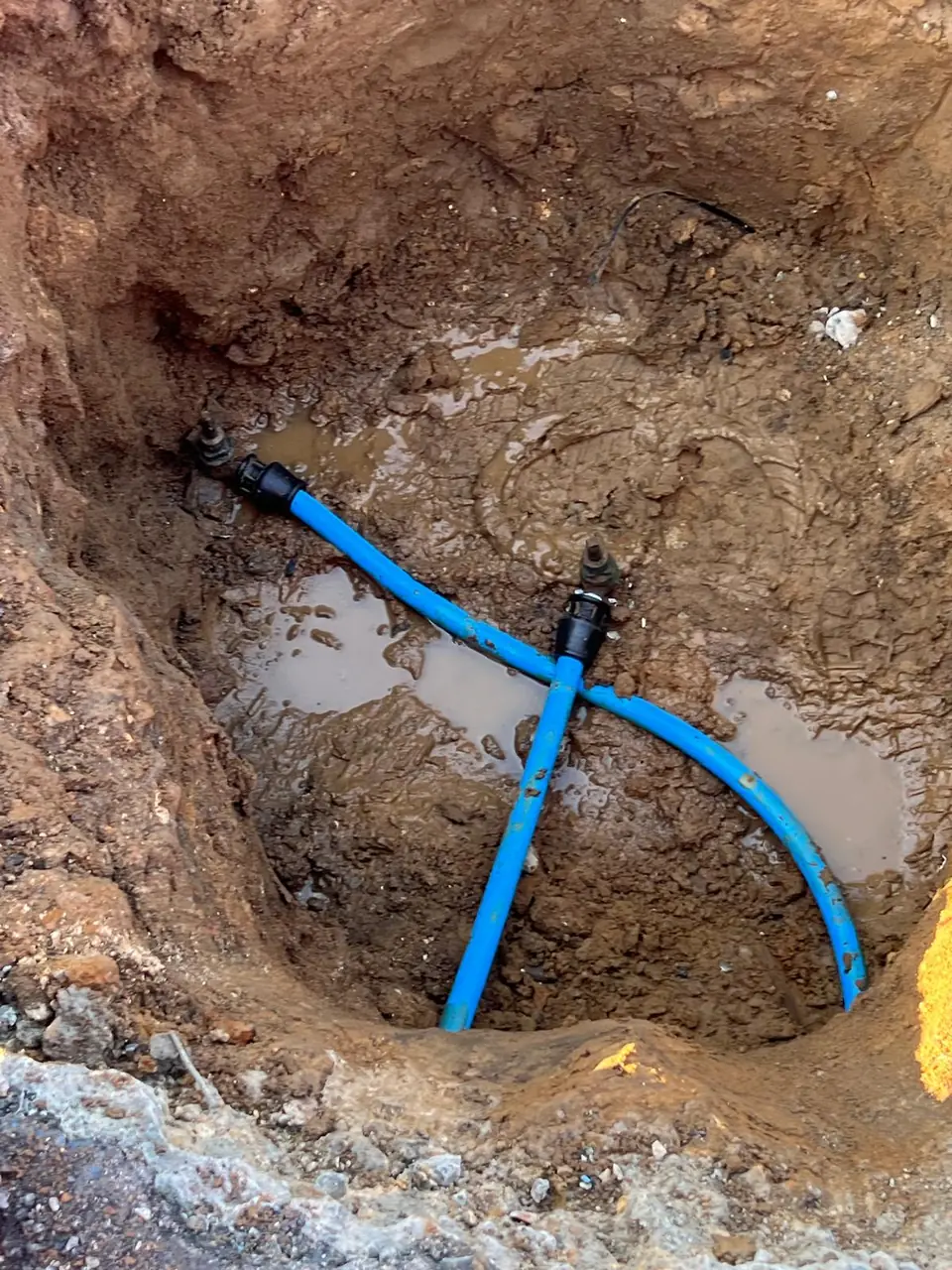 New blue water supply tee connection underground