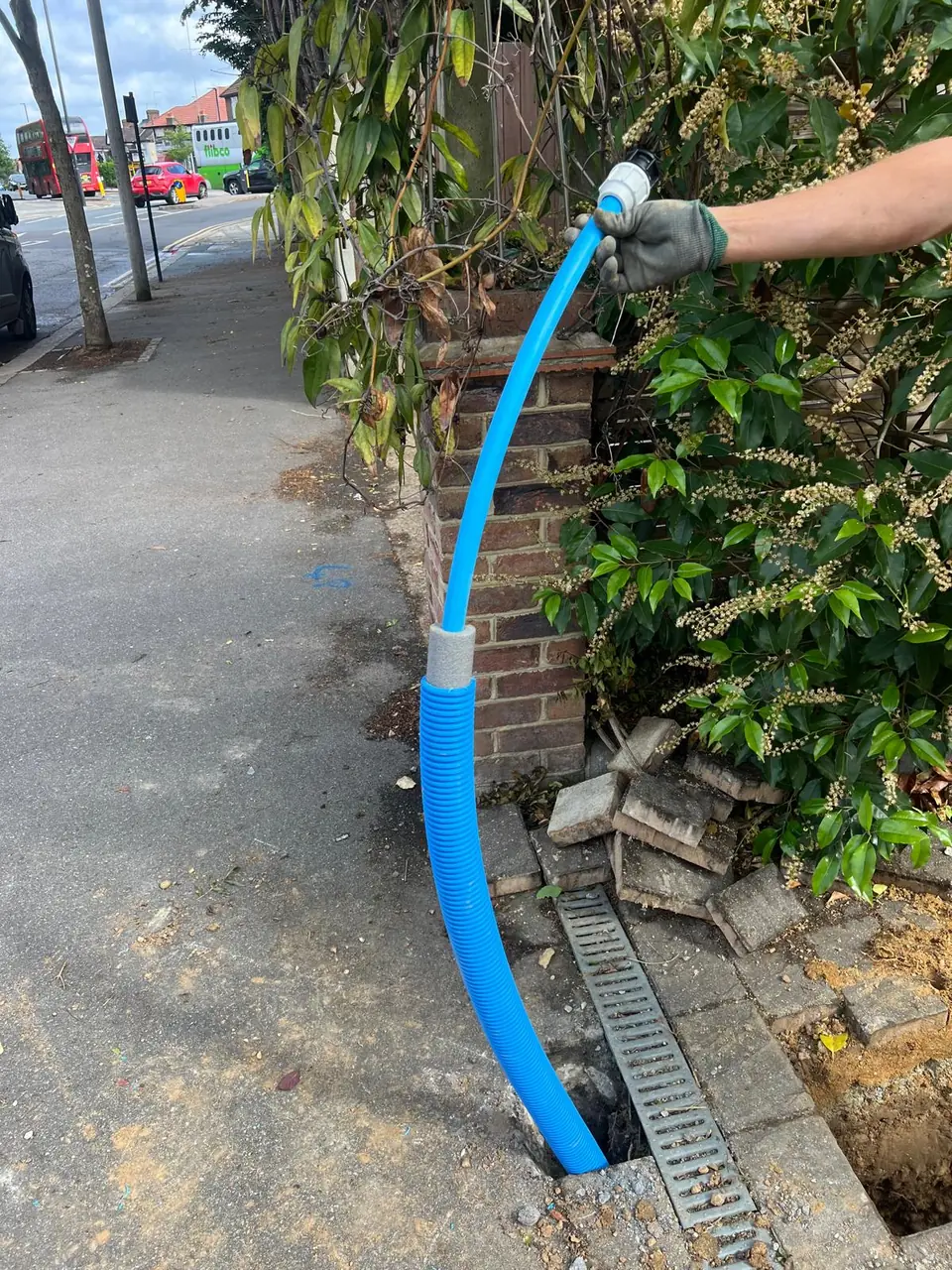 New blue supply pipe routed towards a property