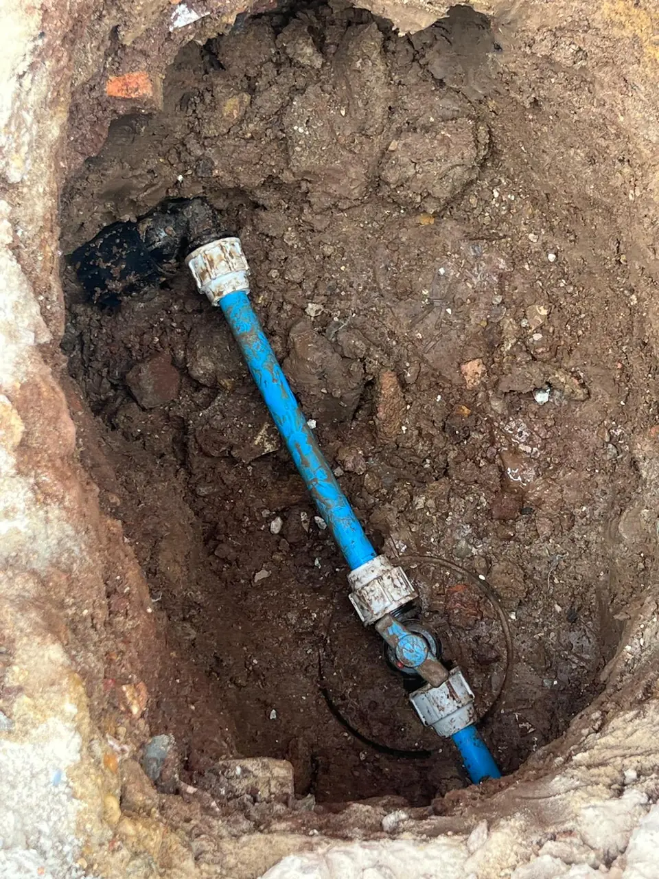 Replacement blue water pipe joined underground