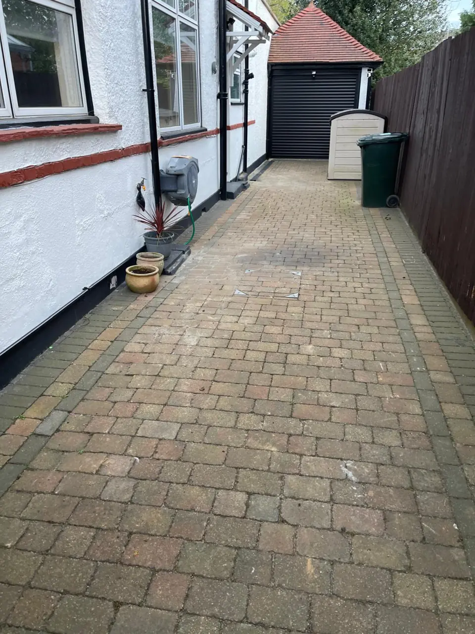 Block-paved driveway neatly reinstated after underground pipework