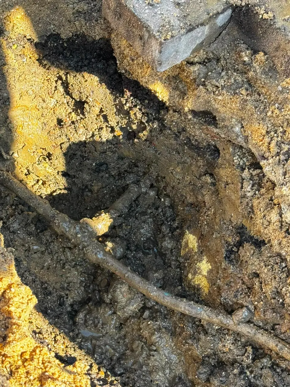 Old underground pipe located within the ground