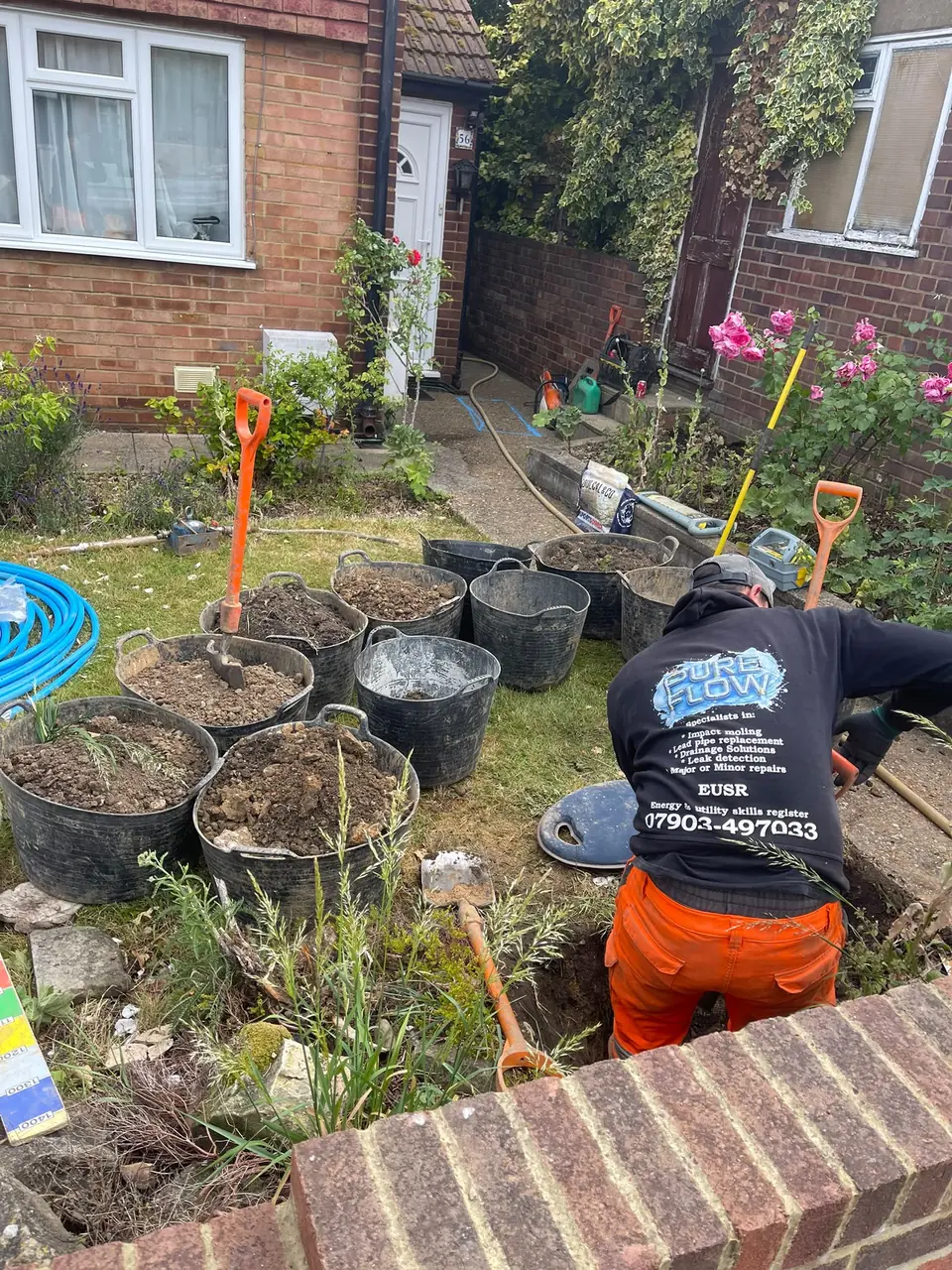 Excavated material contained in tubs during residential pipework