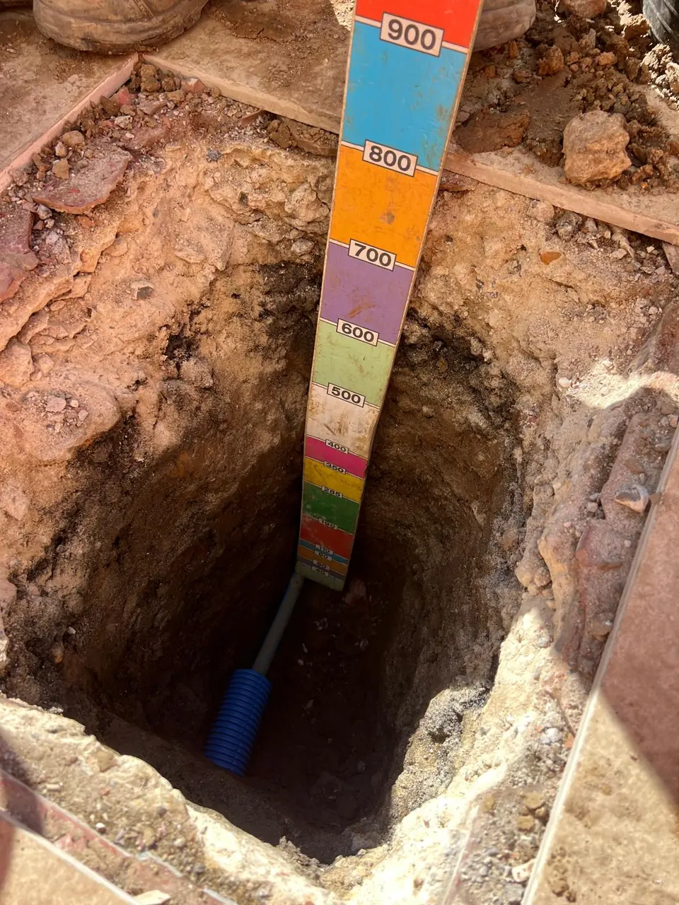 Underground water pipe route with depth marker